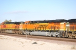 BNSF 6638 left rear quartering shot as the reflects of her Very Brand New Swoosh BNSF paint job.
